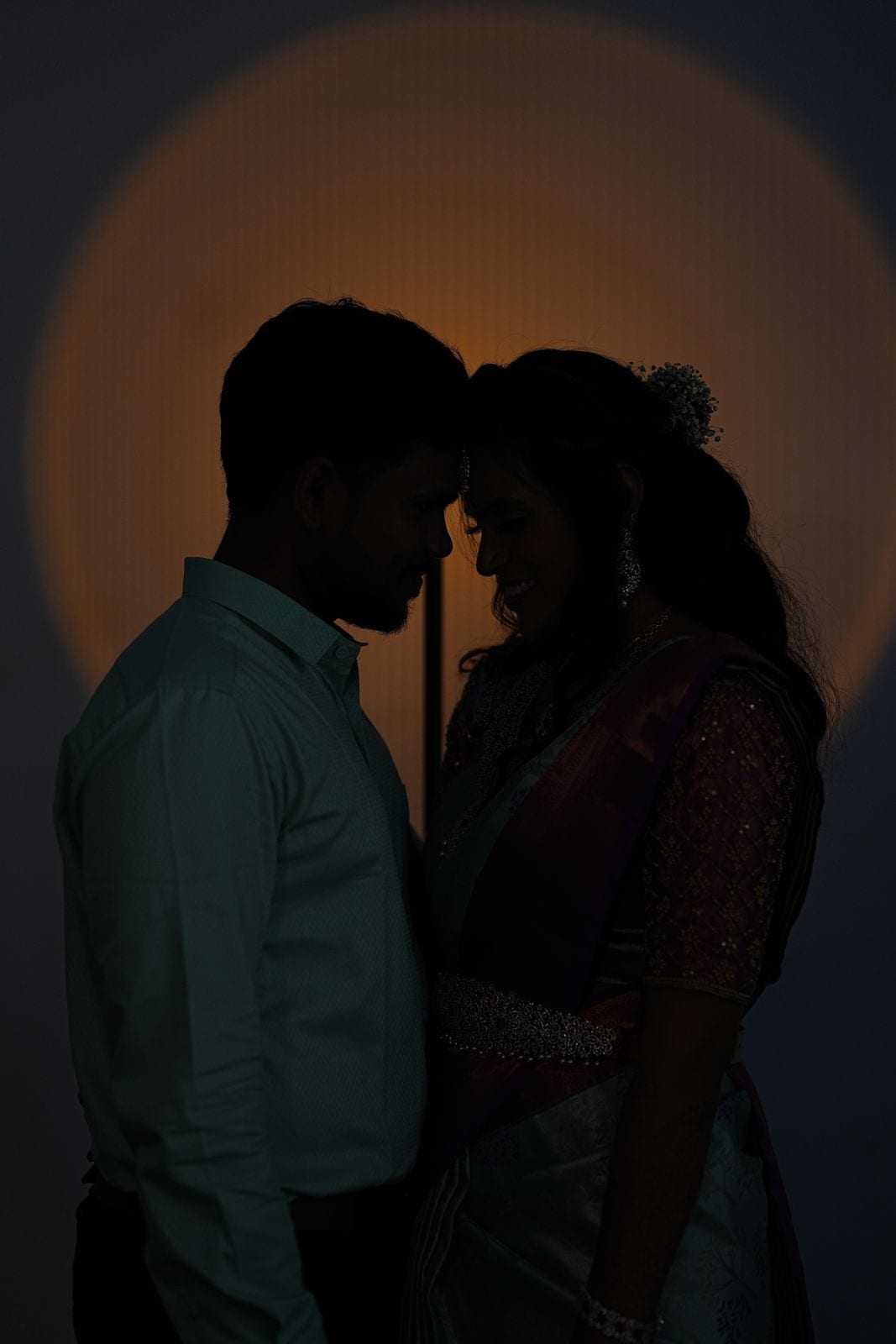 The two of them in silhouette, forehead to forehead